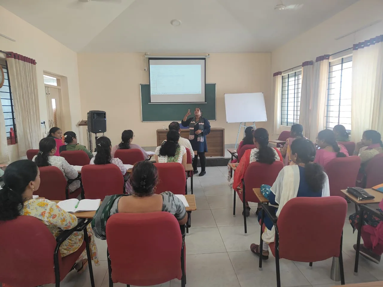 Faculty members attending the FDP workshop with projector presentation on teaching best practices